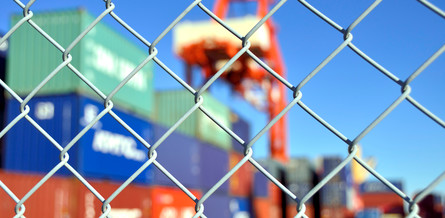 containers behind fence